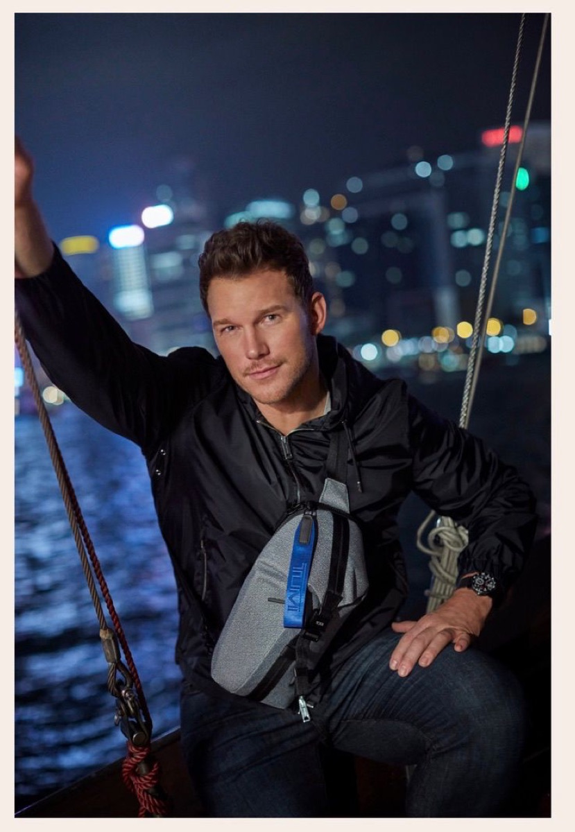 Chris Pratt on a junk boat in Victoria Harbour at night