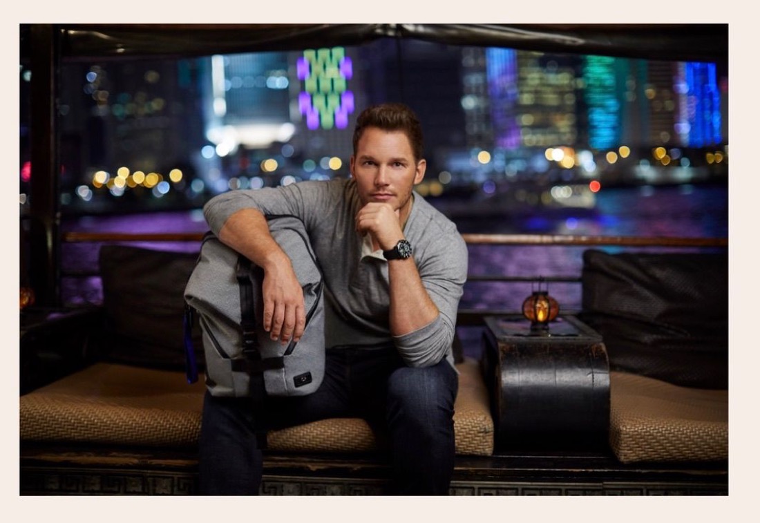 Chris Pratt aboard a junk boat for TUMI, Hong Kong neon behind