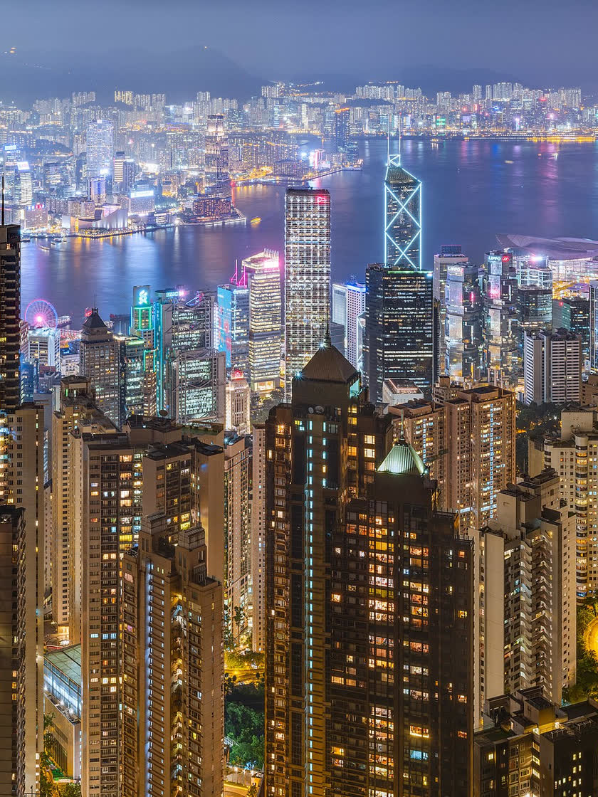 The Hong Kong skyline and Victoria Harbour at night, seen from the Peak