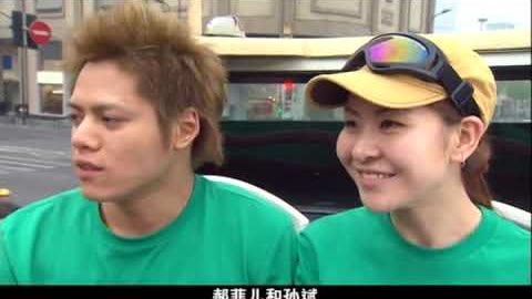 Amazing Race teams racing through a Shanghai street