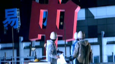 Crew installing a giant red Chinese character — Citibank Believe