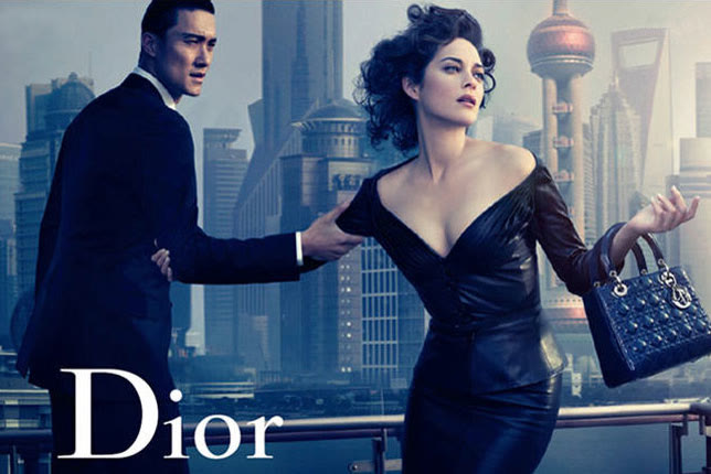 Marion Cotillard with a Lady Dior bag, Shanghai skyline behind