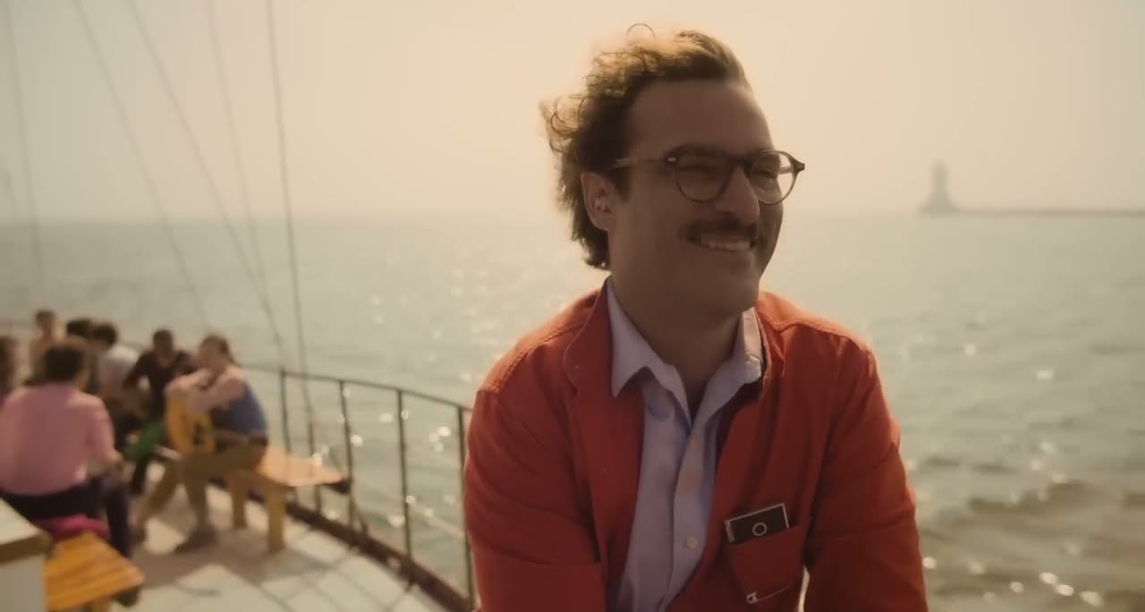 Joaquin Phoenix on a boat in a scene from her