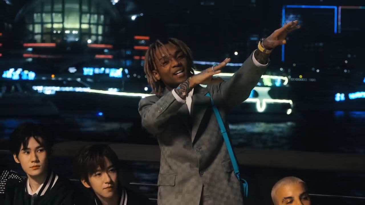 Swae Lee on a junk boat with the Hong Kong skyline at night